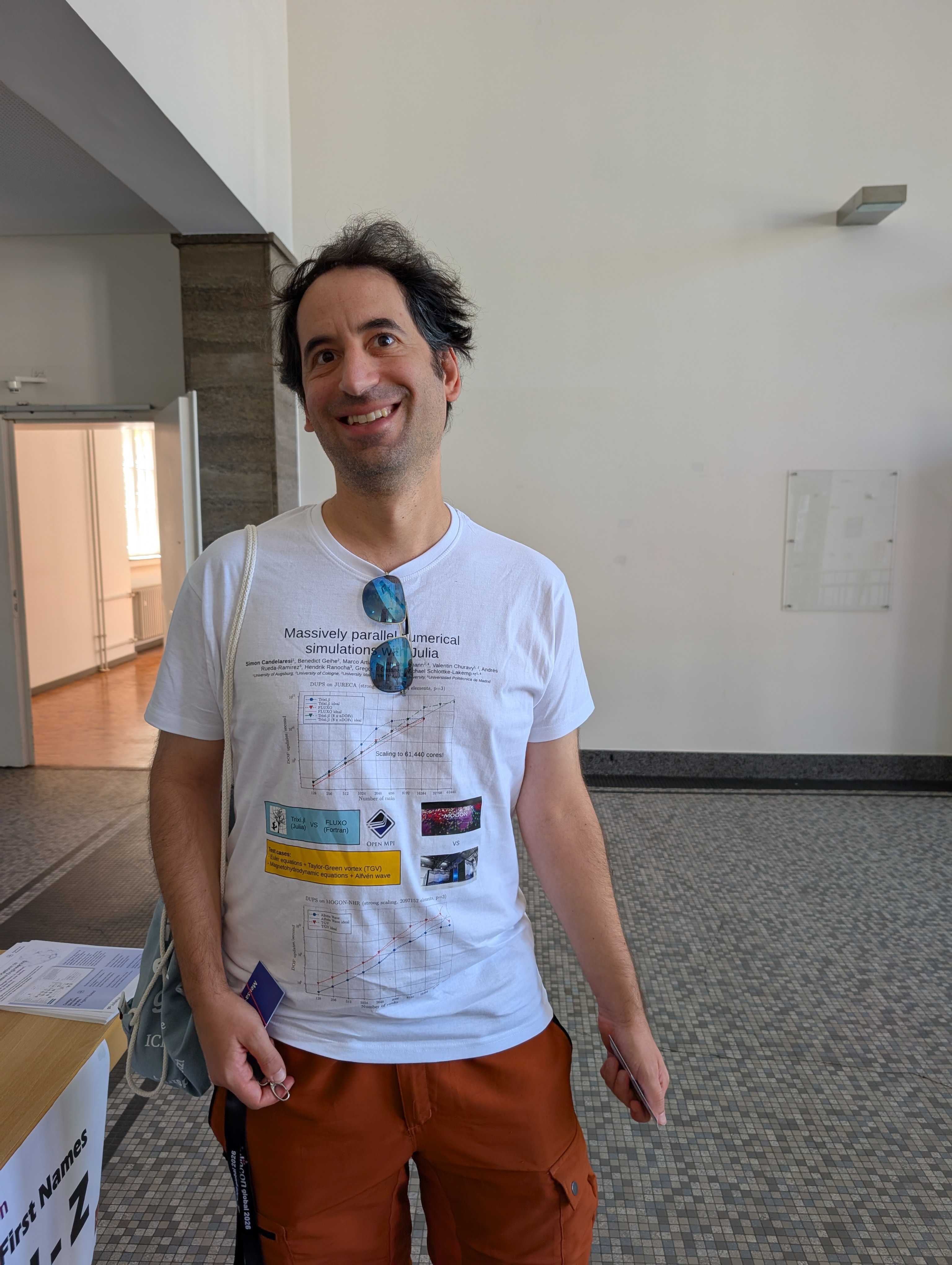 Poster presentation by Simon for the JuliaCon 2026 printed on a t-shirt. © Universität Augsburg